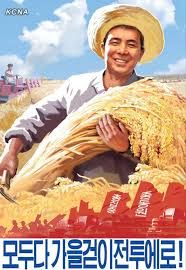 a man in a straw hat is holding some grain