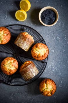 muffins on a cooling rack with lemon slices