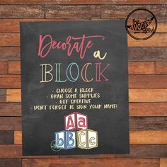 a chalkboard sign on the side of a wooden wall that says, decorate a block