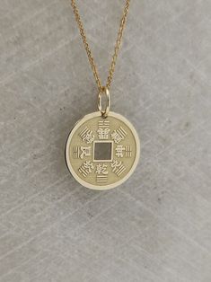 "Chinese Coin Necklace - Engraved Lucky Coin Charm - Gold Chinese Charm - Gold Feng Shui Pendant ▪️ A beautiful and clean engraved Chinese Coin pendant made out of 14K Solid Real Gold. Available only in yellow gold! Pendant Thickness: 0.50mm Jump Ring inner diameter: 4mm Dimensions: - 13mm / 0.52 inches - 15mm / 0.59 inches - 18mm / 0.70 inches - 20mm / 0.78 inches - 22mm / 0.86 inches - 24mm / 0.94 inches Necklace Length - You can choose your chain length from 35CM to 50CM. The pendant is avail Good Luck Coin-shaped Amulet Jewelry, Good Luck Coin Shaped Amulet Jewelry, Good Luck Coin Amulet Jewelry, Symbolic Coin Jewelry For Good Luck, Antique Medallion Jewelry For Good Luck, Vintage Coin Pendant Jewelry For Good Luck, Vintage Good Luck Coin Pendant Jewelry, Antique Engraved Jewelry For Good Luck, Antique Engraved Necklace For Good Luck