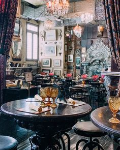 an ornately decorated dining room with chandeliers