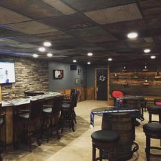 a bar with stools and tables in a room that looks like it is being used as a movie set