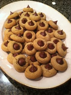 a white plate topped with chocolate chip cookies