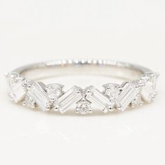 a white gold ring with baguets and diamonds