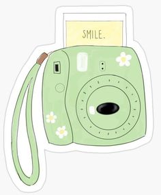 a green camera sticker with the words smile on it