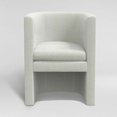 a white chair sitting on top of a white floor