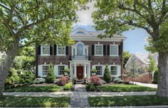 a large brick house surrounded by trees and bushes