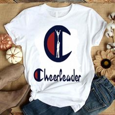 a t - shirt with the word cheerleader on it and a woman holding up her hands