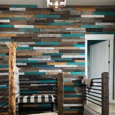 a room with wooden planks on the wall and a bench in front of it