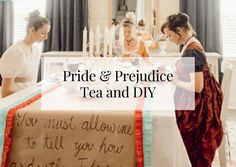 three women sitting at a table in front of a cake with the words pride & prejuce tea and diy written on it