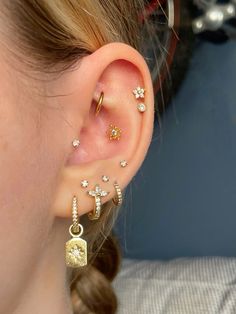 a close up of a person with ear piercings on their left and right ears