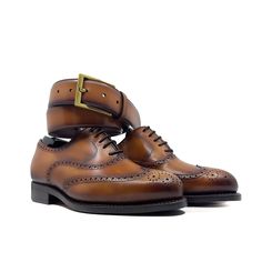 Also known as a wingtip, the Full Brogue is easily identifiable as one of the most classic pairs of men's dress shoes on the market. Featuring a brogue pattern along the sides as well as the toe cap, every man needs a Full Brogue in his shoe closet. The Details: *burnished Materials: Cognac box calf leather Sole: cognac Goodyear leather rubber sole Last: Zurigo - Rounded toe for traditional English Look What is Fast Lane? Fast lane is our new experimental 7 day made to order collection, an ambit Brown Wingtip Shoes For Galas, Business Wingtip Oxford With Leather Sole, Timeless Wingtip Oxford With Leather Sole, Business Wingtip Oxford Shoes With Goodyear Welt, Timeless Wingtip Oxford With Goodyear Welt, Brown Oxfords For Galas With Goodyear Welt Construction, Timeless Goodyear Welted Wingtip Oxford, Timeless Wingtip Dress Shoes For Galas, Wingtip Oxfords With Rubber Sole