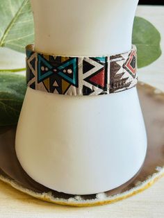 The adorable Aztec print leather cuff bracelet. Made in the USA. This bracelet is the perfect accessory for any womens wardrobe.  This bracelet is a great womens gift. Due to the assorted nature of this item, unique variations in color and print yield one-of-a-kind bracelet. The bracelet you receive may vary in style, print, and color from what is pictured. Adjustable Bohemian Leather Cuff Bracelet, Adjustable Multicolor Cuff Bracelet, Adjustable Southwestern Cuff Bracelet, Southwestern Adjustable Cuff Bracelet, Southwestern Adjustable Leather Bracelet Gift, Southwestern Adjustable Leather Bracelet, Southwestern Adjustable Leather Bracelet For Gift, Bohemian Adjustable Cuff Bracelet For Everyday, Trendy Cuff Leather Bracelet Gift