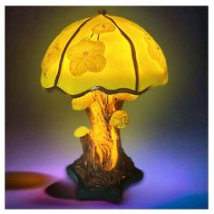 a yellow lamp sitting on top of a table