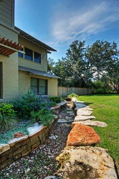 a stone path in front of a house