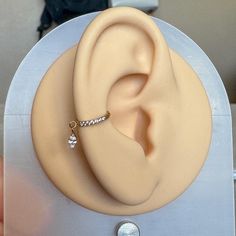 a fake ear with a ring on top of it