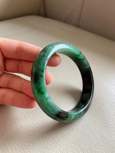 "🌈 Jade Bangle 59.7mm (2.35\"), Round Shape, Green & Light Green 🌷 Untreated Natural Jadeite/ Grade A Jade 🌷 Certification : Yes 🌷 Jade from Myanmar/ Burma 🌷 Shape : Round 🌷 Inner diameter : 59.7mm / 2.35\" 🌷 Width & Thickness : 14.2 x 8.8mm 🌷 Color : Green & Light Green 🌷 Free standard shipping from Hong Kong with tracking included 🌷 Take approximately 7-21 days to arrive worldwide ❤️ In Chinese Culture: Young people wear jade pendant will have a prosperous life, attracts Green Carved Round Bangle, Carved Jade Round Bracelets, Carved Jade Bracelets, Classic Green Round Bangle, Luxury Round Emerald Bracelets, Carved Jade Bracelet, Carved Green Round Jewelry, Green Carved Round Jewelry, Luxury Green Round Bead Bracelets