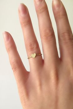 14K 9K Solid Gold Heart Ring, Delicate gold ring, Dainty Rose Gold heart ring, Love Romatnic Jewelry, Minimalist Stacking gold ring, Gift for her, Stackable gold ring, 14K rose gold ring, 9K rose gold ring, 9K gold ring, FREE EXPRESS SHIPPING Dainty 14K or 9K solid gold ring with a tiny heart. Love is always around, hear its whispers and embrace it. <3 More dainty gold rings here: https://www.etsy.com/shop/WhisperGold?ref=seller-platform-mcnav&section_id=23760120 ------------------------- Dainty Stackable Yellow Gold Heart Ring, Dainty Yellow Gold Stackable Heart Ring, Dainty 14k Gold Stackable Heart Ring, Dainty Heart Ring For Everyday, Dainty Heart Ring For Everyday Wear, Dainty Tiny Heart Ring For Everyday, Minimalist Midi Rings With Heart Charm For Wedding, Dainty Stackable Rings With Heart Charm For Wedding, Gold Heart-shaped Stackable Midi Rings