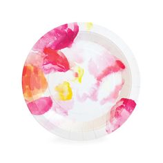 a paper plate with pink, yellow and red paint splattered on it's surface