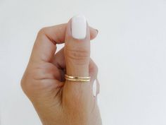 *So simple and so pretty!*This 14k gold-filled ring is made in a thick wire with a sparkly hammered finish and polished to a medium shine.*Adjustable and easy to wear with other rings or alone for a minimalist look.*For a sterling silver ring like this:https://www.etsy.com/listing/215657076/thumb-ringsterling-silver-ringminimalist?ref=shop_home_active_2*To see more of my handmade original rings visit my etsy shop rossanajewelrydesign.etsy.com*Ships within 3-5 business days. Nice and safe packagi Minimalist Gold Toe Rings As Gift, Minimalist Gold Toe Rings For Gift, Gold Minimalist Hypoallergenic Toe Rings, Minimalist Gold Hypoallergenic Toe Rings, Hypoallergenic Minimalist Gold Toe Rings, Minimalist Gold Stackable Toe Rings, Simple Gold Hypoallergenic Stackable Rings, Minimalist Gold Midi Rings With Double Band, Thumb Ring Gold