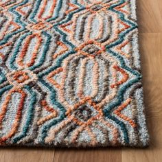 a multicolored area rug on the floor