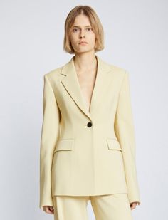 cinched single-breasted blazer from PROENZA SCHOULER featuring light yellow, notched lapels, front button fastening, shoulder pads, long sleeves, buttoned cuffs, two front flap pockets, fitted waistline and straight hem. Light Yellow Suit Women, Proenza Schouler Shoes, Yellow Suit, Exaggerated Sleeves, Breasted Blazer, Suit Separates, Proenza Schouler, Light Yellow, Shoulder Pads