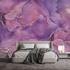 a bedroom with purple and gold marble wallpaper