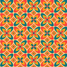 an orange and blue flower pattern with many different colors on the petals, as well as circles