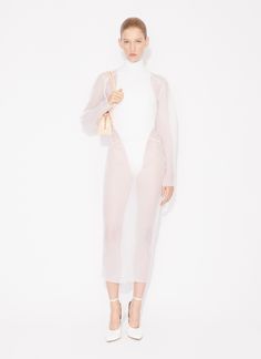 ALAÏA Women's Coat Dress | ALAÏA US Stretch Midi Dress With Sheer Sleeves For Evening, Fitted High Neck Dress With Sheer Bodice, Chic Stretch Mesh Dress With Sheer Sleeves, High Neck Dresses With Sheer Bodice, Evening Dresses With Mesh Sleeves And High Neck, Chic Sheer Dress In Polyamide, White Stretch Dress With Sheer Sleeves, White Midi Dress With Sheer Sleeves For Evening, Sheer High Neck Dress For Summer