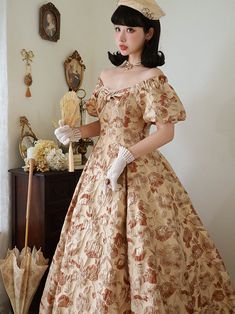 A classic dress depicting tree leaves on a white brown background with golden fabric woven into it. Elegant design with ribbon decoration on the chest. The fabric is thick and sturdy, and the flared skirt gives it an elegant look. She is a noble lady with a gorgeous aura. 
 
 
 Size 
 
 
 
 
 S size 
 
 Length: 129cm 
 Bust: 84cm 
 Waist: 68cm 
 Sleeve length: 22cm 
 
 M size 
 
 
 Length: 130cm 
 Bust: 88cm 
 Waist: 72cm 
 Sleeve length: 23cm 
 
 L size 
 
 Length: 131cm 
 Bust: 92cm 
 Waist: 7 Elegant Beige A-line Vintage Dress, Elegant Beige Victorian Dress For Formal Occasions, Elegant Brown Vintage Dress, Elegant Fitted Gold Victorian Dress, Vintage Beige Midi Dress For Formal Occasions, Gold Vintage Evening Dress, Brown Vintage Evening Dress, Vintage Brown Evening Dress, White Classic Dress