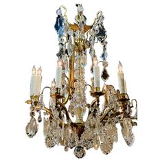 a chandelier with many crystal pieces hanging from it