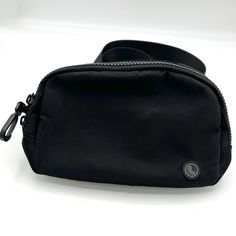 a black bag sitting on top of a white table