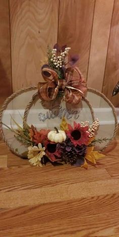 a basket filled with flowers sitting on top of a wooden floor