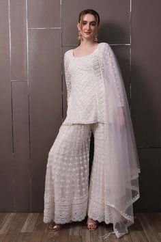 Off-white organza kurta with floral, thread and sequins hand embroidery. Comes with palazzo and a dupatta. - Aza Fashions Fitted Off White Palazzo Set With Dupatta, Designer Embellished White Palazzo Set, White Palazzo Set With Dupatta For Reception, White Embellished Palazzo Set For Designer Wear, Embellished White Palazzo Set For Designer Wear, White Silk Sharara For Reception, Elegant White Palazzo Set For Festivals, White Silk Sets For Reception, White Silk Set For Reception