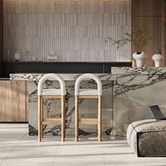 two stools sitting next to each other in front of a marble counter and wall