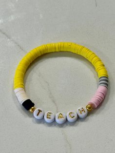 Silicone beaded stretchy bracelet.  Beads designed to look like pencil for the teachers in your life!  This item is NOT customizable, and colors may appear slightly different then picture. Adjustable Multicolor Beaded Bracelets For Teacher Appreciation, Multicolor Adjustable Beaded Bracelets For Teacher Appreciation, Pencil Bracelet, Stretchy Bracelets, School Colors, Silicone Beads, Bead Designs, Clay Beads, Bracelet Making