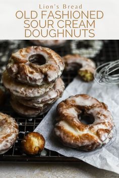 a bunch of doughnuts sitting on top of a cooling rack