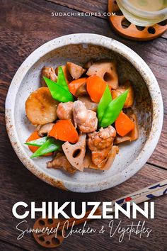 a bowl filled with food on top of a wooden table