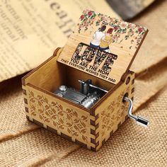 a wooden music box sitting on top of a table