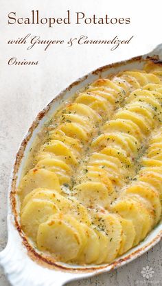 a casserole dish filled with potatoes and herbs