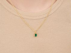 A dainty stone and delicate metallic chain are combined to create this Gold Pendant Necklace in bright emerald, your new favorite wear-anywhere accessory. The birthstone for the month of May is Emerald. This translucent green gemstone increases generosity, improves decision-making, and symbolizes compassion. High-quality lab-created emerald stone; Made of 14K gold-filled. Pendant size: 6mm x 4mm with 18" chain. Hypoallergenic, nickel, and lead-free; Tarnish resistant. Ideas to choose your Births Month Of May, May Birthday, Lab Created Emerald, May Birthstone, Emerald Necklace, 14k Gold Necklace, Pretty Necklaces, Emerald Stone, Cute Necklace