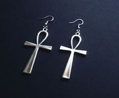 Large earrings with ankh crosses. Total drop length: 8 cm  Materials: metal alloy Colour: antique silver Sold as a pair. Earrings come with silicone backs. All items come beautifully packaged. **PLEASE NOTE** : Standard Shipping is untracked to keep the shipping costs low. If you want to TRACK YOUR ORDER please select the SHIPPING UPGRADE at checkout! I ship from Germany, you can check my shop policies for estimated shipping times to international locations. However, in some cases it can take lo Egyptian Earrings, Ankh Cross, Egyptian Jewelry, Large Earrings, Earrings Silver, Shop Policies, Antique Silver, Jewelry Earrings Dangle, Egypt