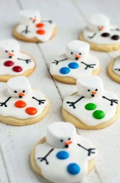 decorated sugar cookies with frosting and icing on white wood planks, ready to be eaten