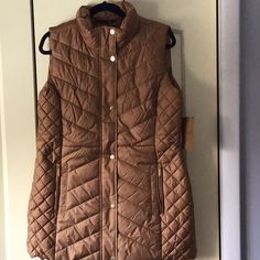 For A Cold Weather Look, Reach For This Women’s Puffer Vest With Water Resistant Shell. Cozy Sherpa Lines Upper Back Half Snap And Zipper Front With 2 Zipper Pockets. Designed To Hit Above The Knees. Back Tabs At Waist For Adjustable Fit. Mid-Weight. Polyster Questions? Leave A Comment Below! Long Puffer, Vest Coat, Sherpa Lined, Puffer Vest, Above The Knee, Womens Vest, Front Zipper, Cold Weather, Zipper Pocket