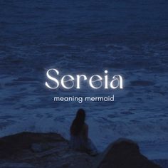 a woman sitting on top of a rock next to the ocean with text reading sereia meaning mermaid