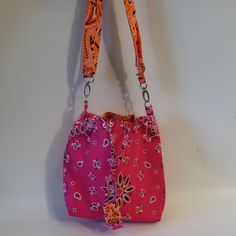 Nwt Womens Bits And Pieces To Go Pink Orange Bandana Crossbody Handbag * Retail: $140- Color: Pink, Orange/Neon Bandana Print Drawstring Closure Crossbody Strap Material: Textile Measurements: Depth: 3.6" Height: 10.2" Width: 11.5" Strap Drop: 24" New With Tags. (Bag- 777) ...Tna_rslyn_dad622- 4** Pink Shoulder Bag With Snap Closure, Pink Crossbody Bucket Bag For Travel, Pink Crossbody Shoulder Bag With Snap Closure, Pink Travel Shoulder Bag With Snap Closure, Pink Shoulder Bag With Snap Closure For Travel, Pink Shoulder Bag With Snap Closure For Daily Use, Pink Rectangular Hobo Bag For Daily Use, Trendy Pink Rectangular Hobo Bag, Pink Shoulder Bag For Summer