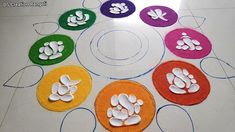 an arrangement of different colored rugs with animal footprints on them in the middle of a circle