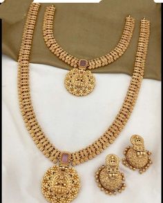 Traditional handcrafted gold plated Goddess temple necklace set from the house of the Lucentartsjewellery Shop. Its intricate  detailing with peacock motifs and studded ruby stones makes it look more royal and elegant. Adorned with matching attire, it will add brilliance and spark to the entire look. Perfect choice for weddings, parties, gifting, and other Indian festivals. Keep it in Zip Locks or Plastic Boxes. Dispatched within 7 working days. Keep the jewelry away from heat, water, sprays, an Gold Plated Necklaces For Marriage, Antique Gold Temple Bridal Necklace As Gift, Rose Gold Brass Necklace For Wedding, Elegant Copper Necklace For Weddings, Gold Copper Necklace As A Gift, Gold Jewelry Sets As Gift With Intricate Design, Gold Temple Jewelry Sets For Anniversary, Gold Bridal Necklace With Intricate Design As Gift, Elegant Gold-colored Copper Necklaces