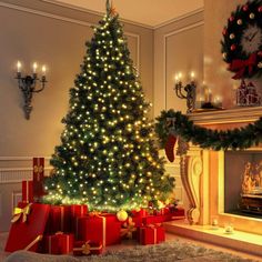 a decorated christmas tree in front of a fireplace