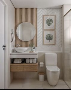 a bathroom with a toilet, sink and mirror in it's centerpieces